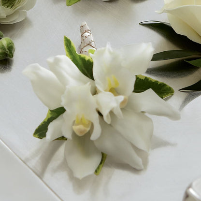 White Mini Cymbidium Boutonniere –  Meramec Florist, Steelville MO